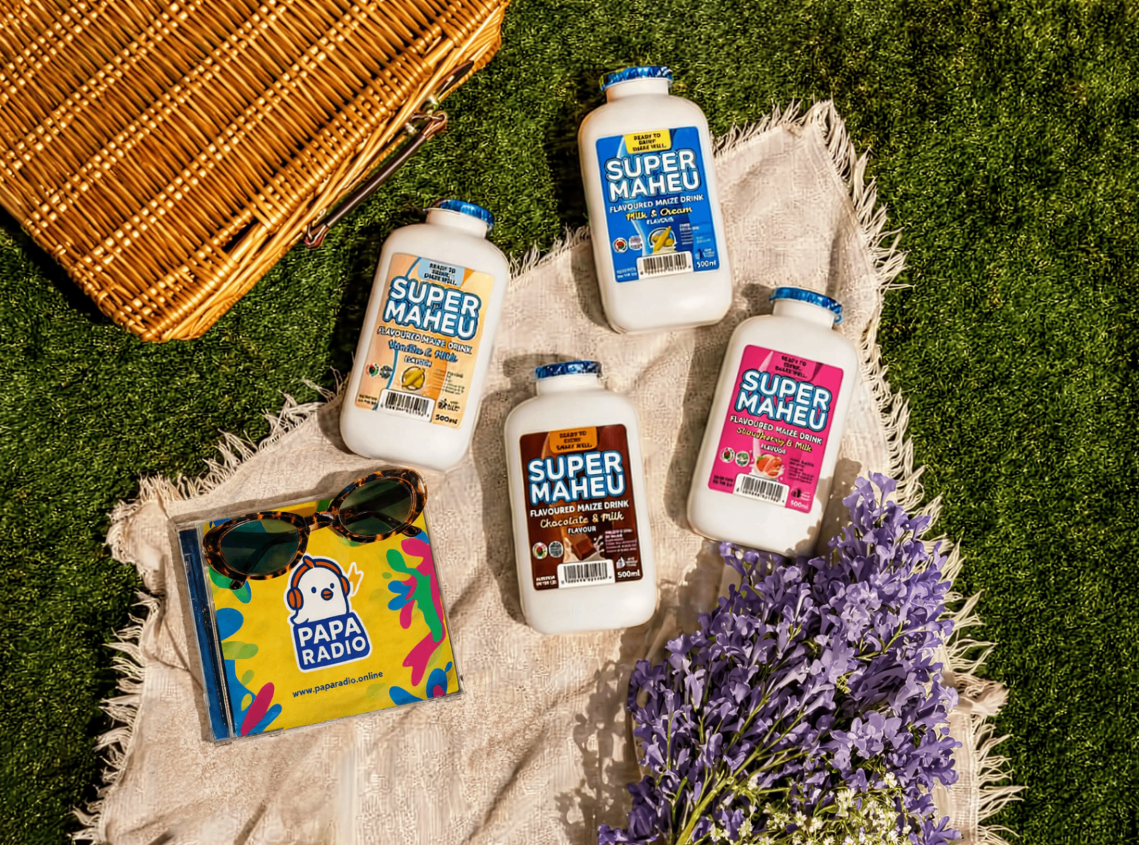 Super Maheu flavoured maize drink range on a picnic blanket.