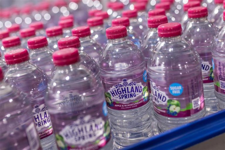 Bowler Beverage Apple & Blackcurrant Still Spring Water bottles on production line – sugar-free flavoured spring water from Scotland.